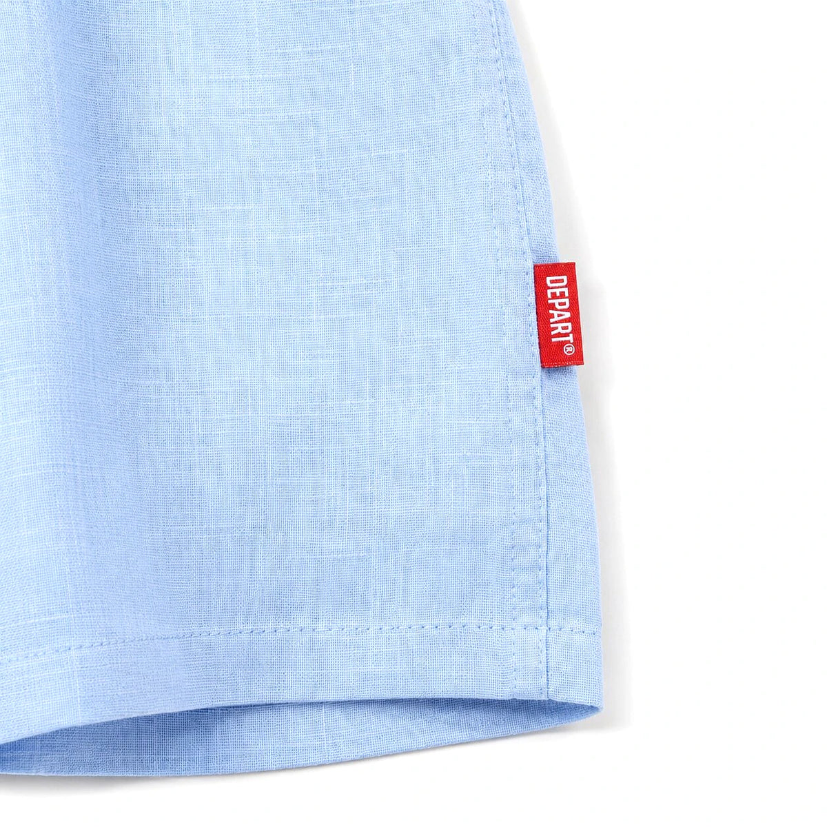 Depart Chemise Lin Bleu Ciel — texture lin et étiquette sur la manche, original BirdNova Algérie
