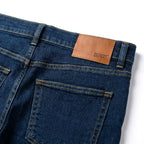Patch cuir orange et poche arrière du Depart Jean Slim Bleu Indigo — original BirdNova Algérie