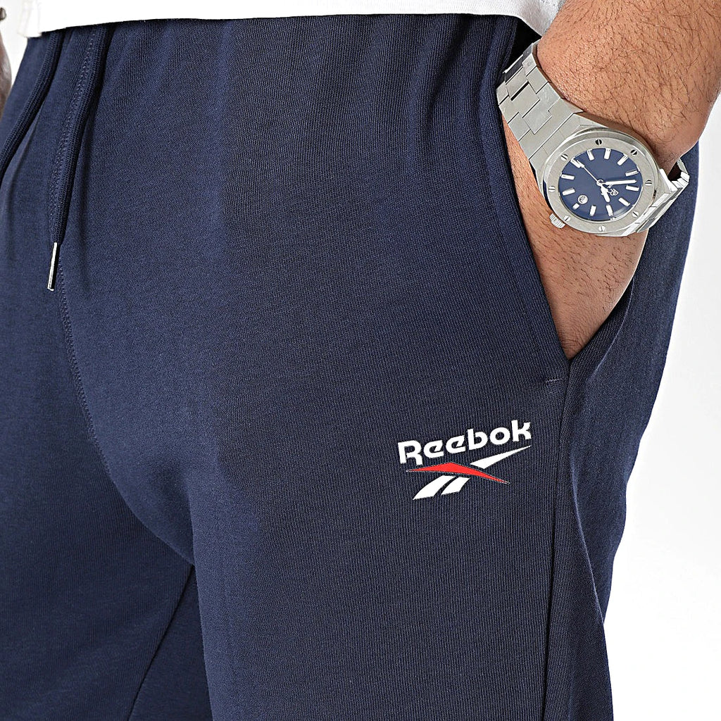 Logo Reebok Vector brodé sur la poche du jogging marine — original BirdNova Algérie