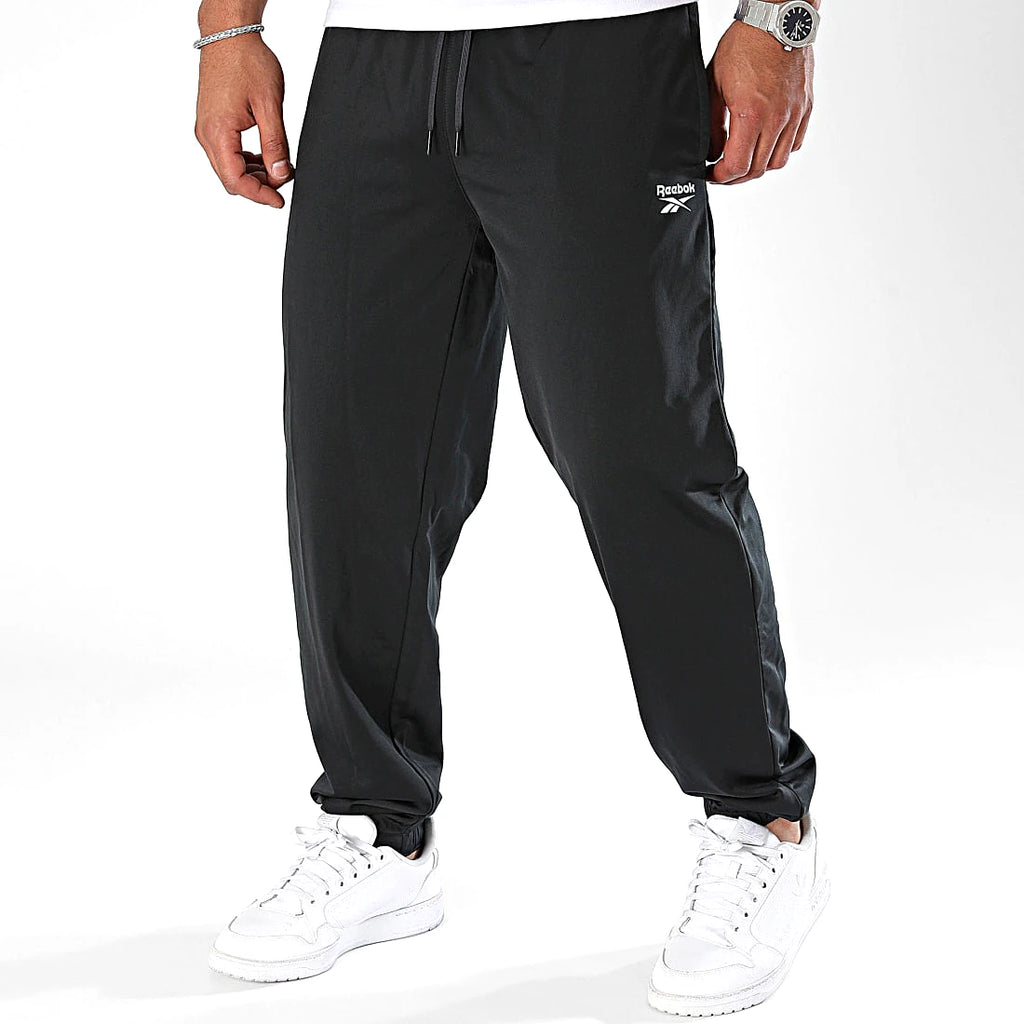 Reebok Jogging Noir Tissé, vue de trois quarts avec chevilles élastiquées, BirdNova Algérie