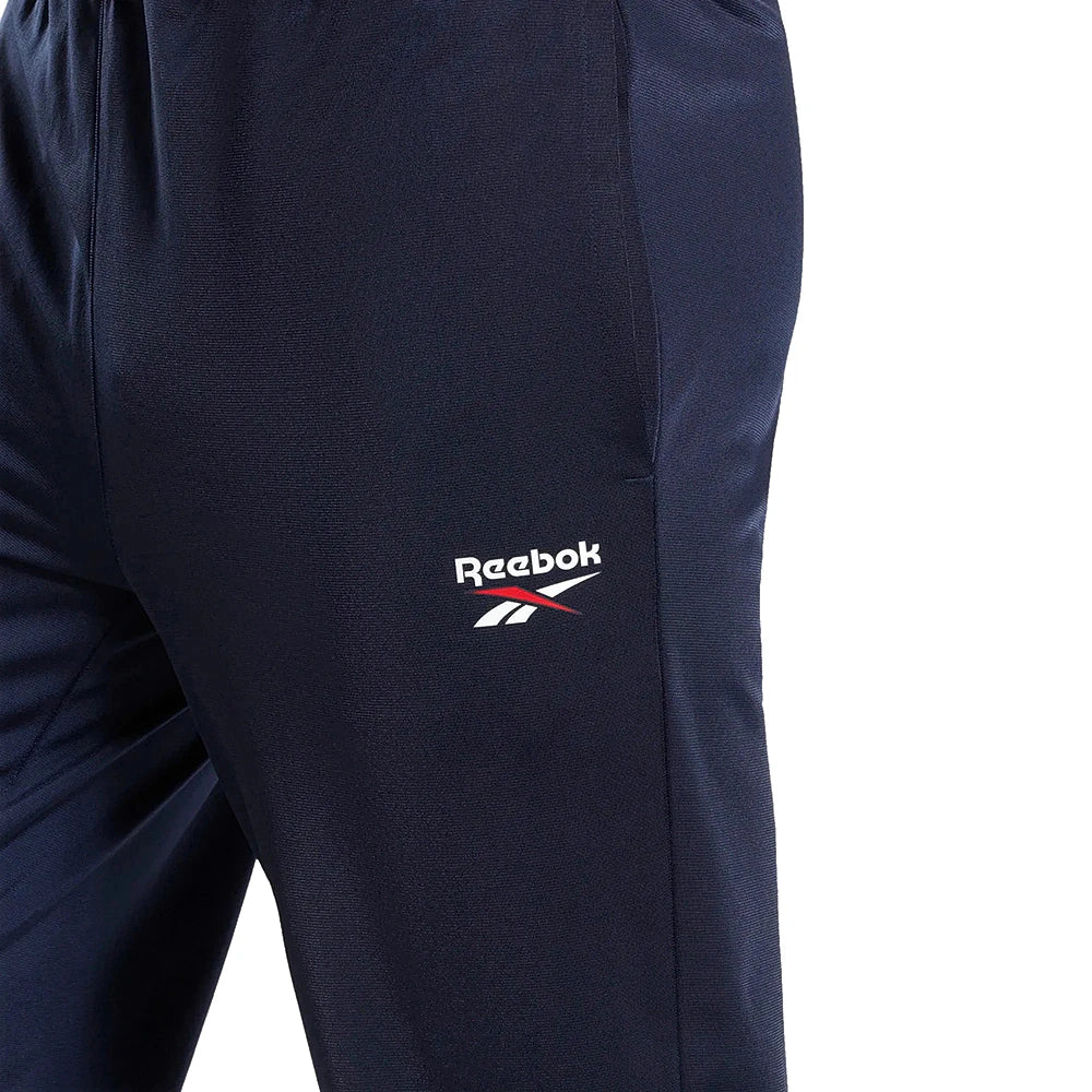 Reebok Pantalon De Survêtement Marine, gros plan sur le logo Reebok blanc de la cuisse, BirdNova Algérie
