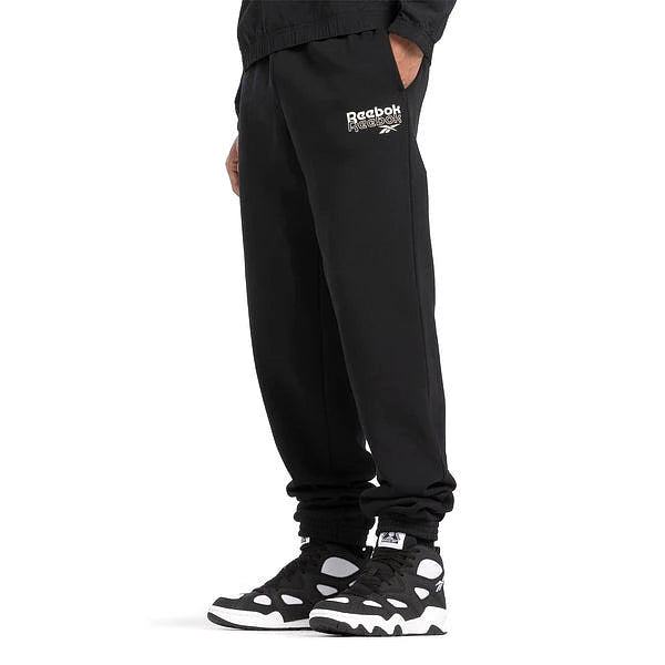 Reebok Jogging Noir Homme avec logo blanc sur la cuisse — jogging original BirdNova Algérie