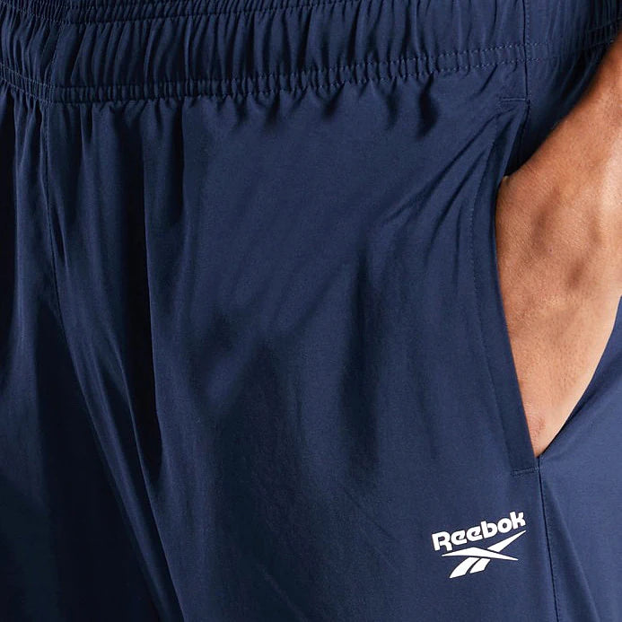 Reebok Pantalon 3/4 Bleu Marine, gros plan sur la poche et le logo Reebok, BirdNova Algérie