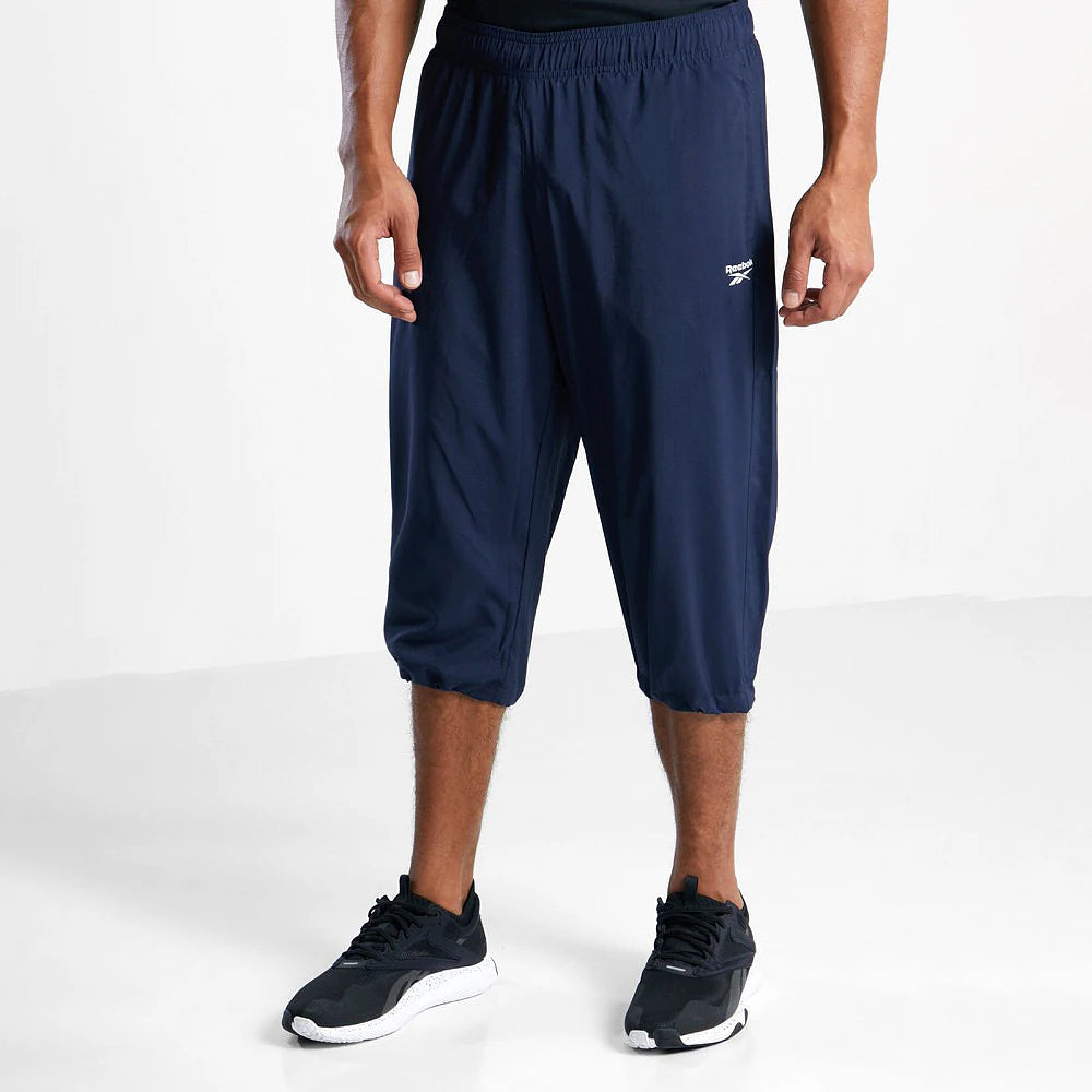 Reebok Pantalon 3/4 Bleu Marine, vue de face avec baskets noires, BirdNova Algérie