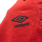 Umbro Polo Rouge — logo double diamant marine, original BirdNova Algérie