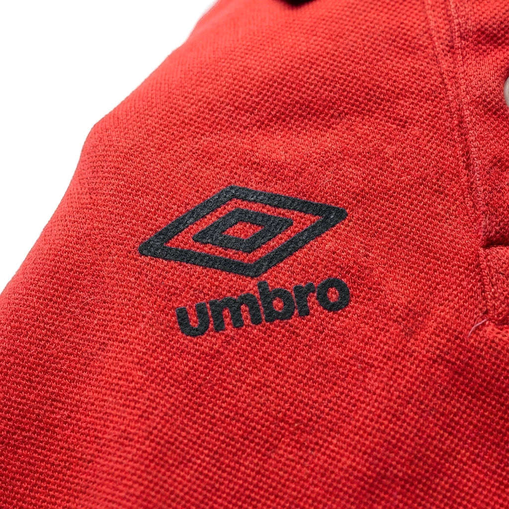 Umbro Polo Rouge — logo double diamant marine, original BirdNova Algérie