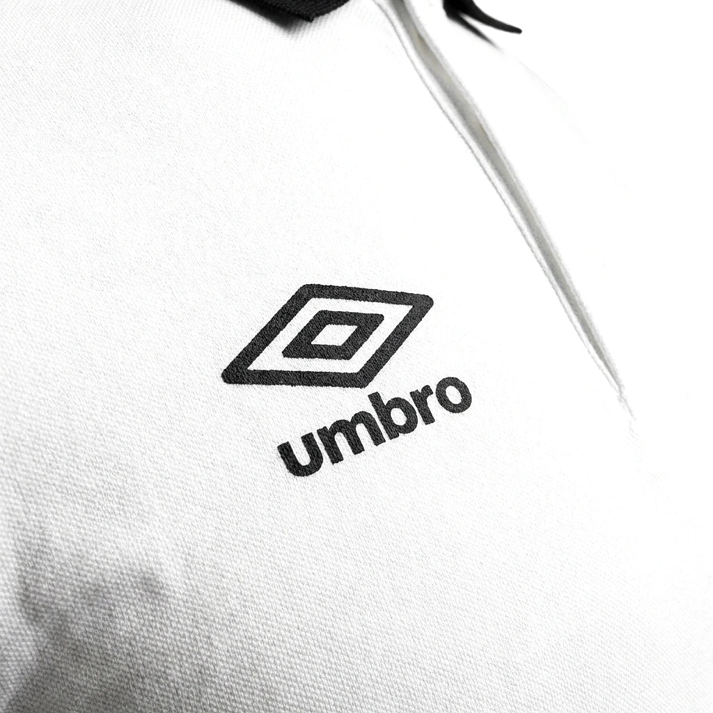 Umbro Polo Blanc — logo double diamant foncé, original BirdNova Algérie