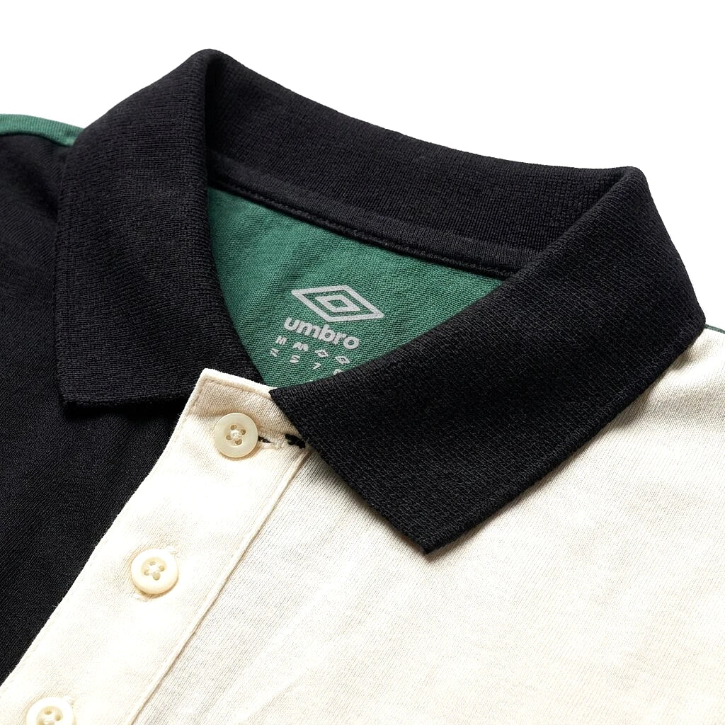 Col noir et patte crème du polo Umbro vert en gros plan — original BirdNova Algérie