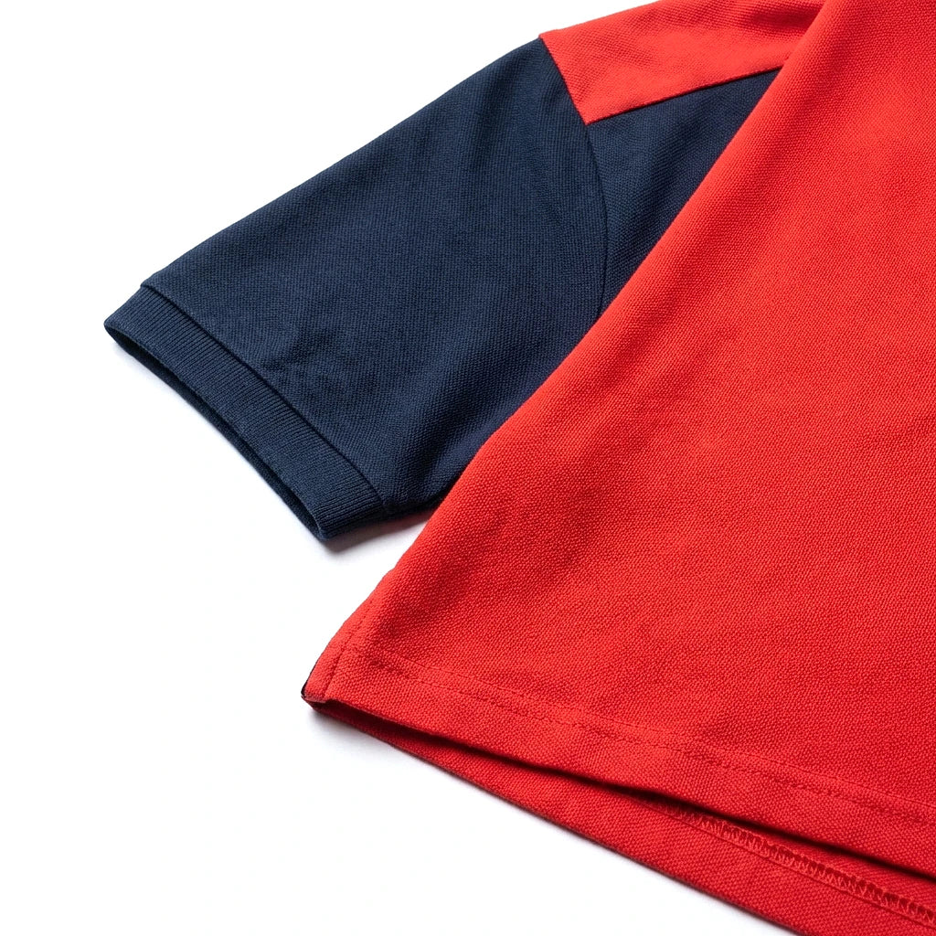 Umbro Polo Bicolore — manche marine et bande rouge Umbro, original BirdNova Algérie