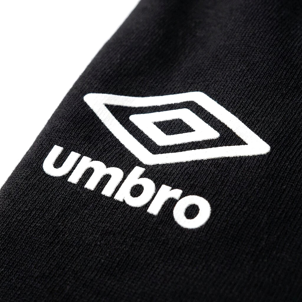 Logo Umbro losange blanc du polo noir et bleu — original BirdNova Algérie
