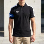 Umbro Polo Noir Brassard Bleu Royal porté par un homme — original BirdNova Algérie