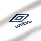 Umbro Polo Blanc — logo double diamant marine, original BirdNova Algérie