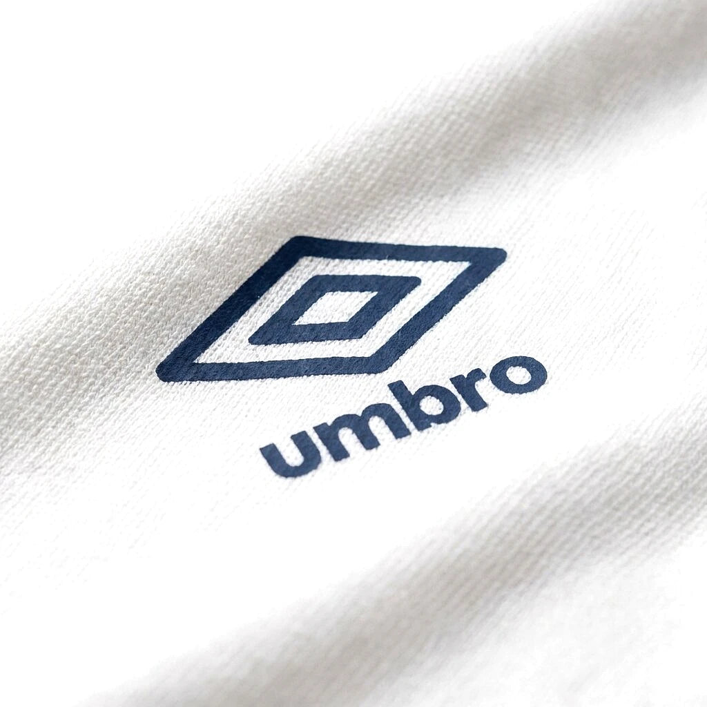 Umbro Polo Blanc — logo double diamant marine, original BirdNova Algérie